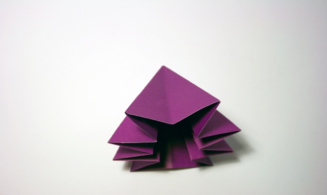 A purple, origami arrow.